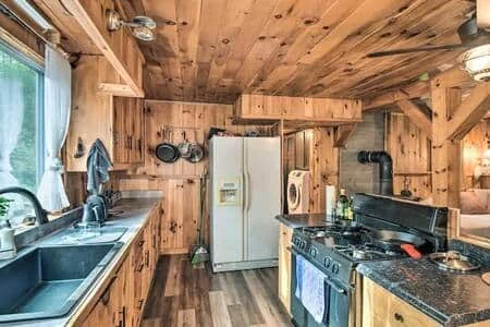 Kitchen with gas stove and refrigerator